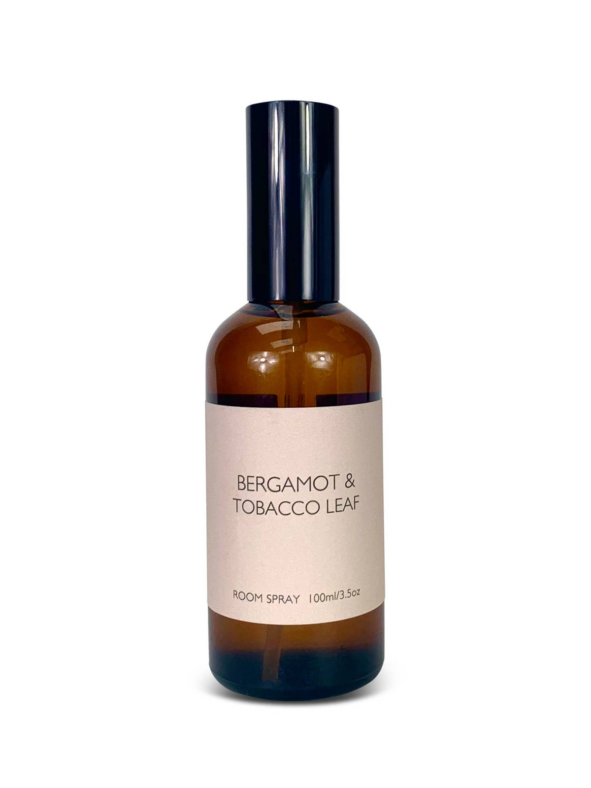Room spray bottle labeled 'Bergamot & Tobacco Leaf' on a white background