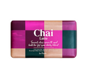 A rectangular bar of tea soap labeled 'Chai Latte' by brand iv Flon, featuring a checkered pattern of magenta, beige, and dark green blocks on a white background.