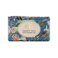 A rectangular bar of 'Green Tea' luxury vegetable soap by 'The English Makers' in a blue floral and bird patterned wrapper, centered on a plain white background.