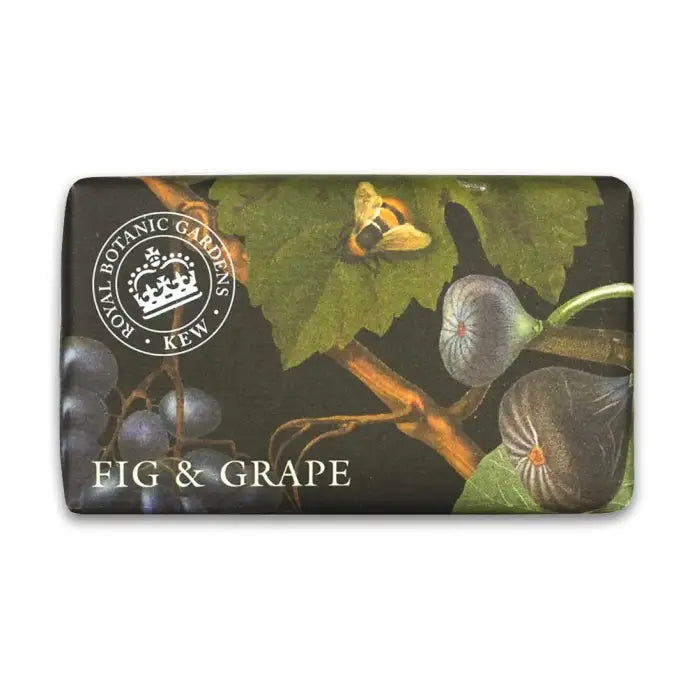 A rectangular decorative plaque or sign featuring an illustrated botanical design of figs and grapes on a dark background, with a circular Botanic Gardens London Kew logo and the words 'FIG & GRAPE' printed on it. - The Fig House