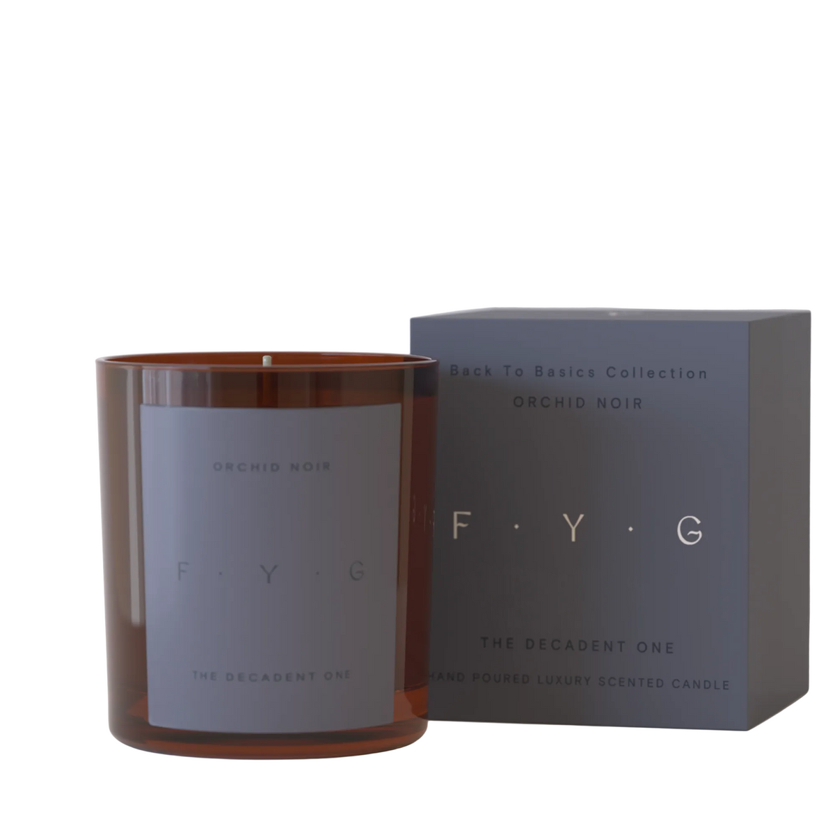 An amber glass scented candle with a gray label next to its dark gray packaging box, both featuring the brand F.Y.
