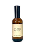 Room spray bottle labeled 'Pink Pepper & Cedar' on a white background