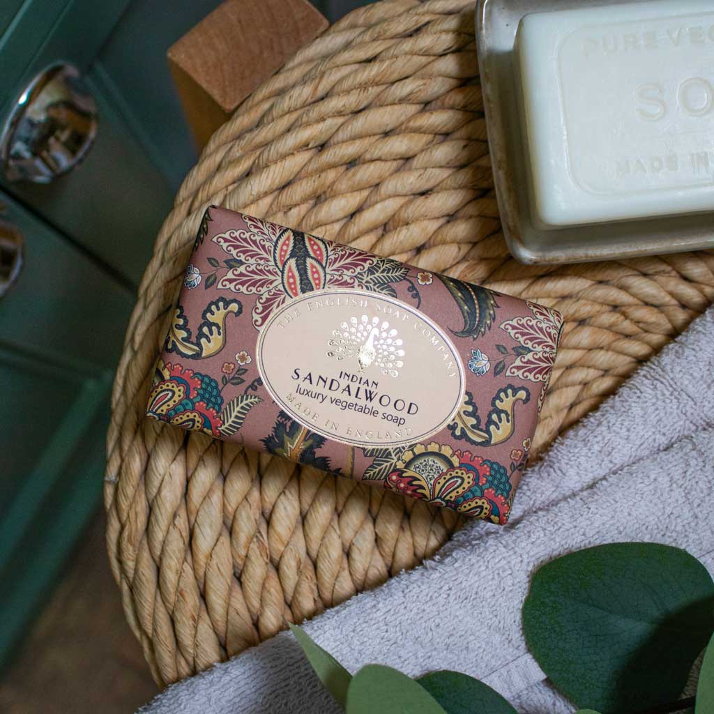 Decorative soap bar with sandalwood scent on a woven mat - The Fig House