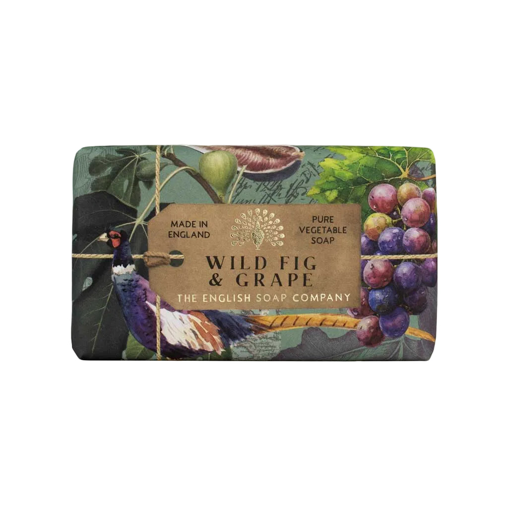 Soap bar with 'Wild Fig & Grape' label and decorative design on a beige background