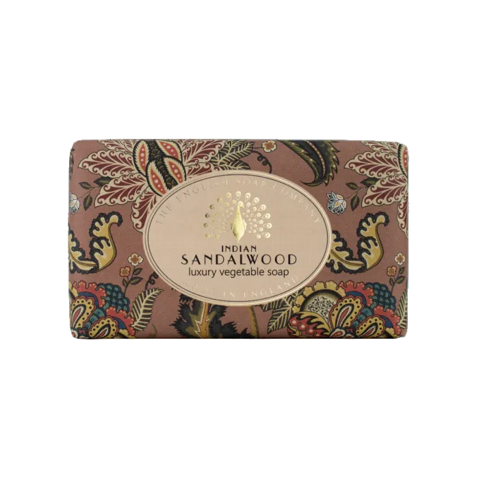 A rectangular bar of Indian Sandalwood luxury vegetable soap in ornate multicolor paisley packaging with a central beige oval label, shown on a plain white background. - The Fig House