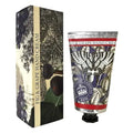 A tube of Fig & Grape Hand Cream next to its matching rectangular box, both featuring a vintage-style botanical illustration of grapes and a butterfly, with a cream-colored vertical band on the box. - The Fig House