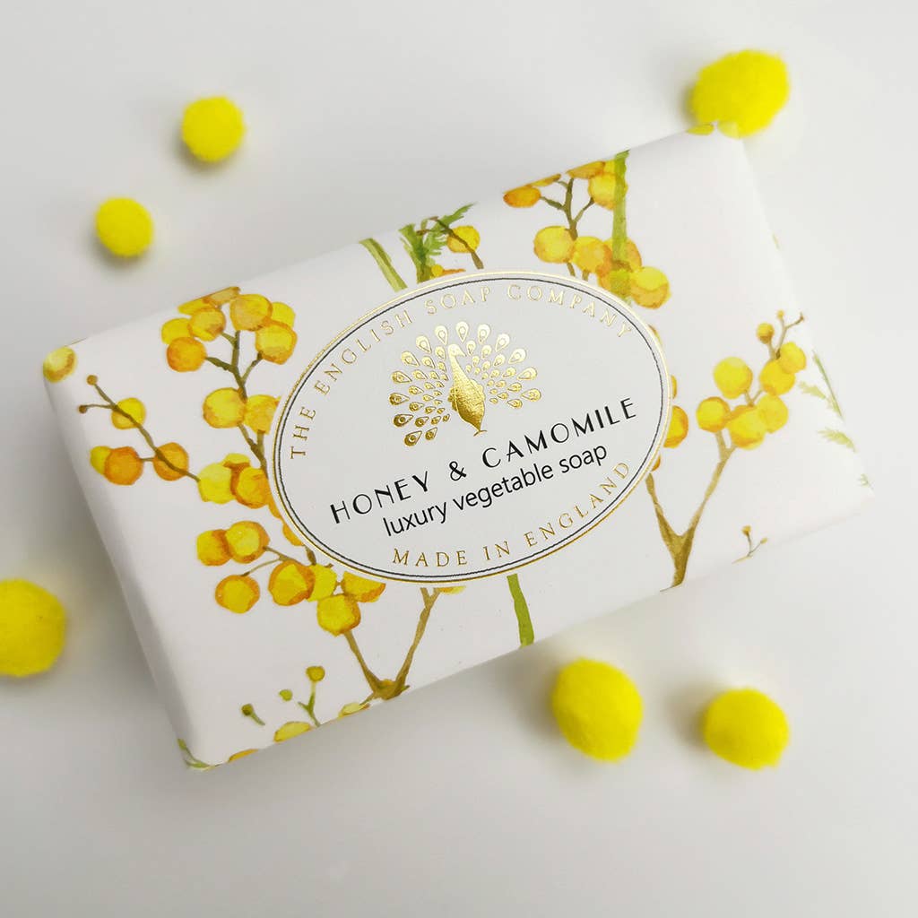 Soap bar with honey and camomile design on a white background