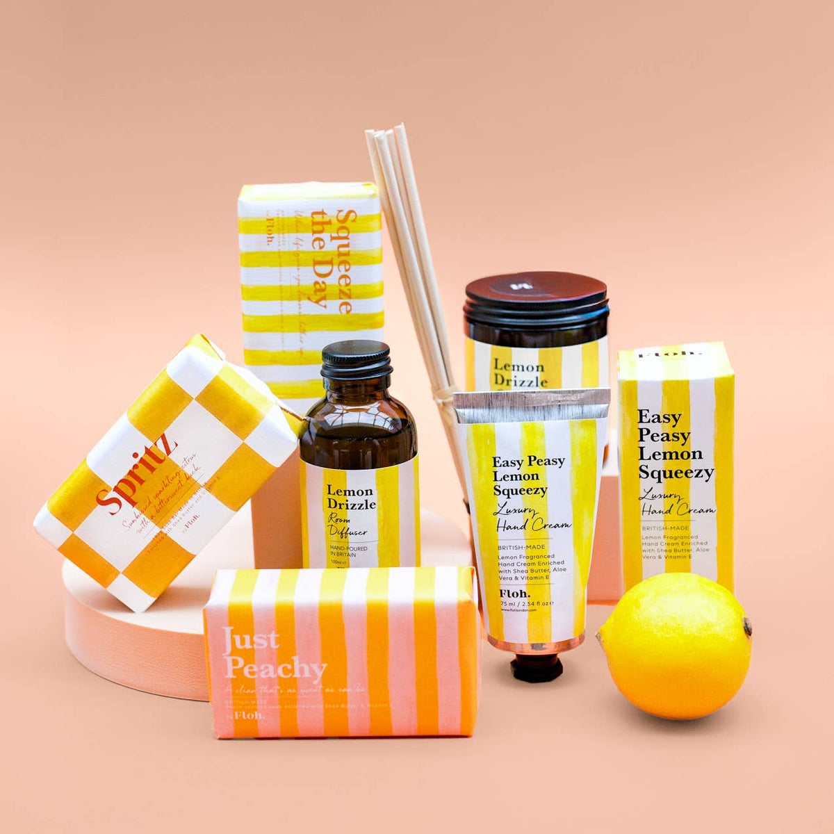 Collection of 'Easy Peasy Lemon Squeezy' products on a peach background