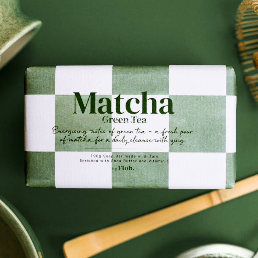Matcha green tea soap bar with packaging on a green background